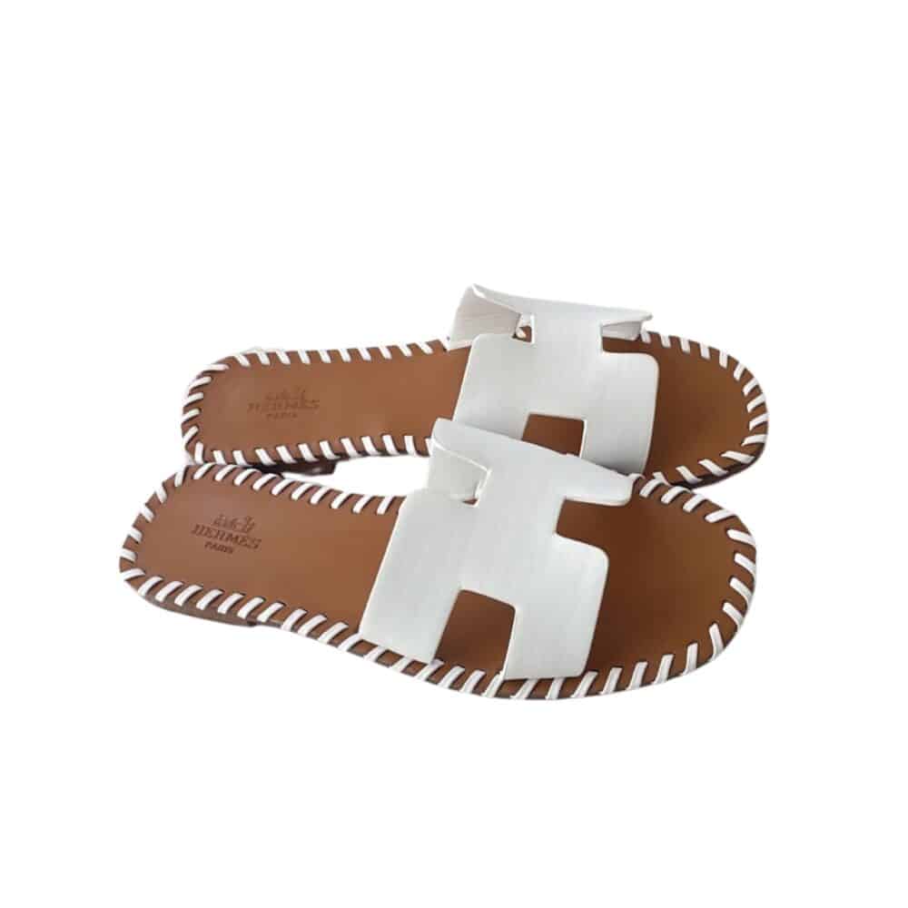 HERMÈS ORAN SANDALS STITCHING IN BROWN AND WHITE